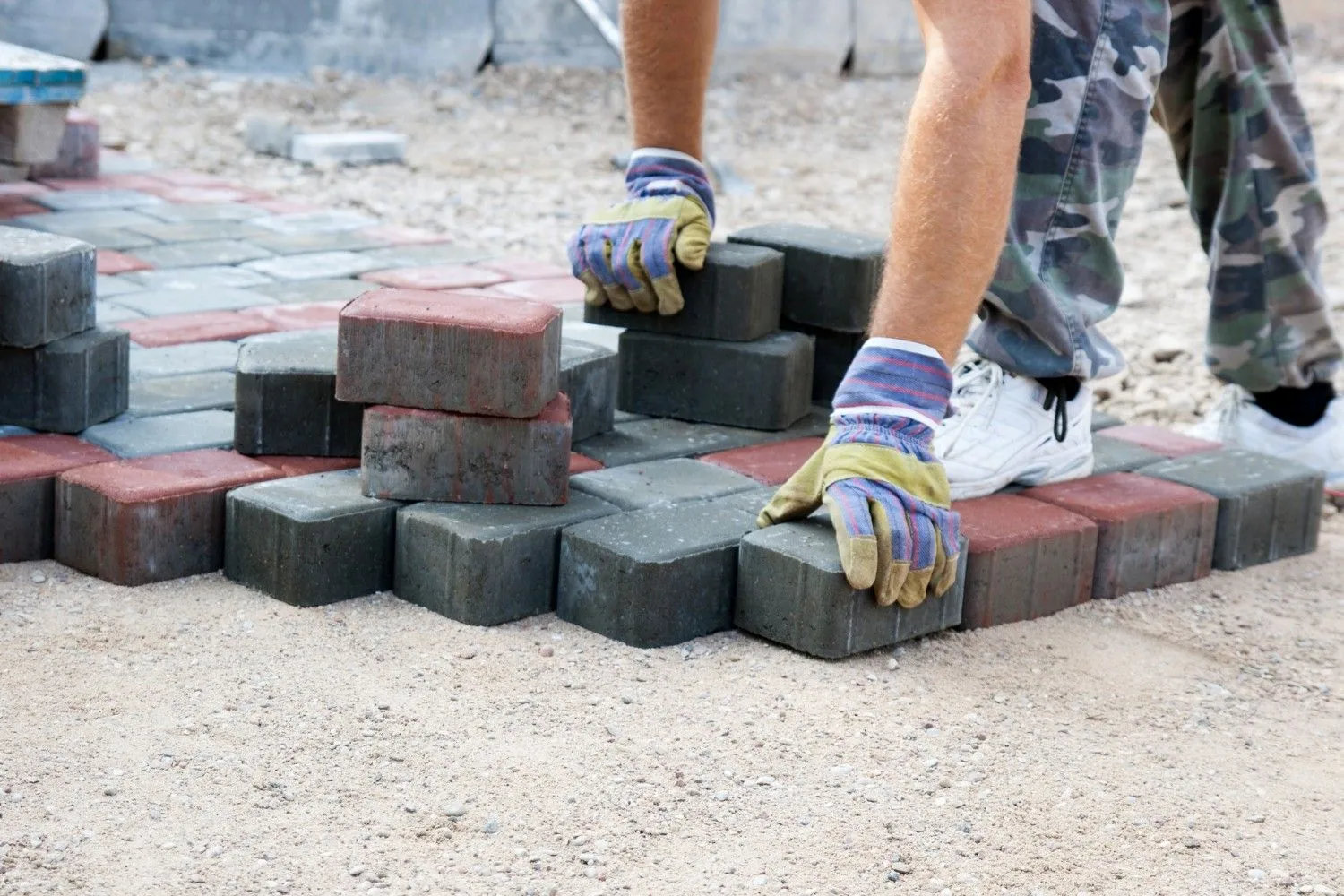 contractor laying pavers